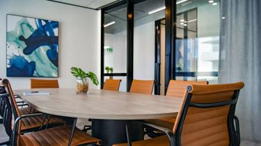 brown wooden 9-piece office table and chairs