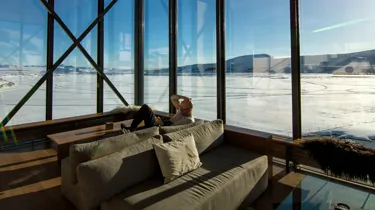 man sitting on brown couch