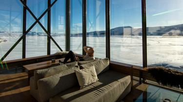 man sitting on brown couch
