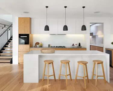 brown wooden seat beside white wooden table
